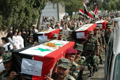 Obsèques de 13 victimes civiles et militaires du terrorisme, le 2 octobre à Homs